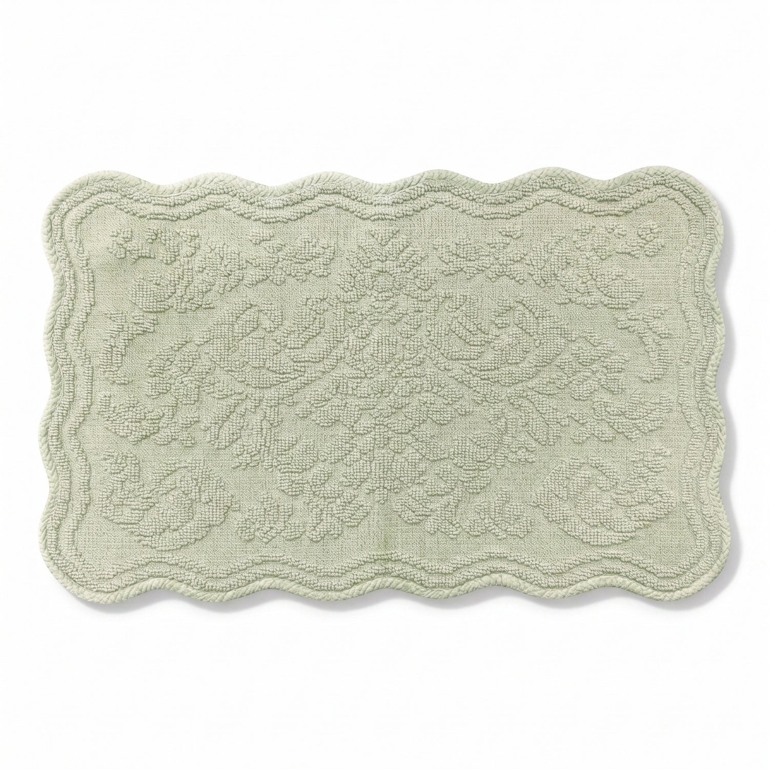 Scalloped bath mat in sage green colour, with floral texture design - made from 100% cotton.