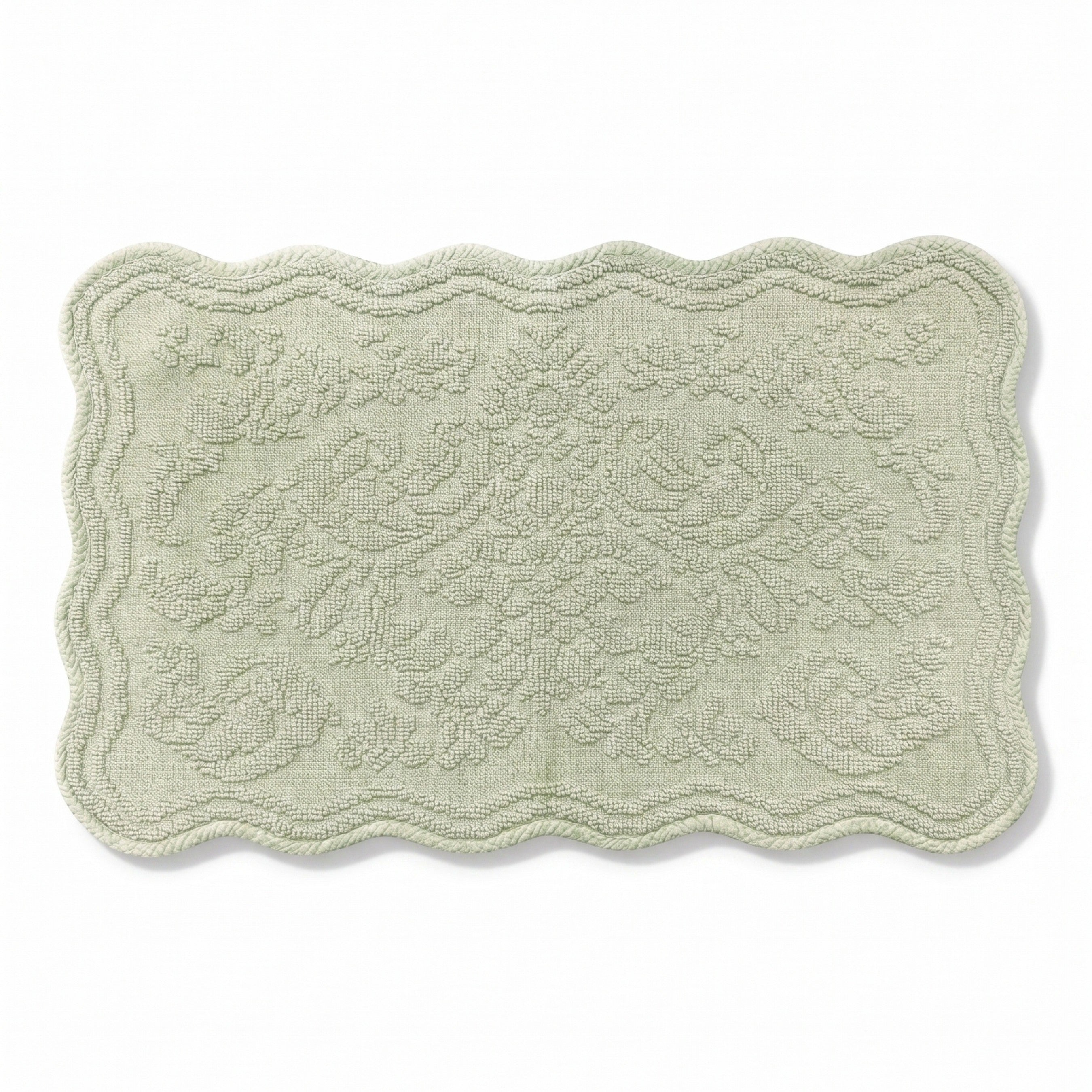 Scalloped bath mat in sage green colour, with floral texture design - made from 100% cotton.