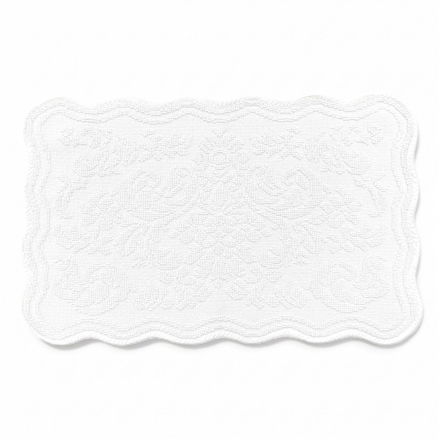 Scalloped bath mat in white colour, with floral texture design - made from 100% cotton.