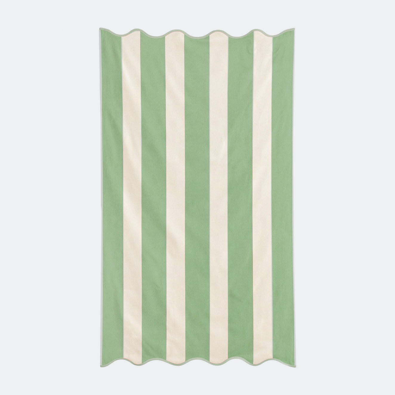 Green striped beach towel with scalloped edge, made from cotton.
