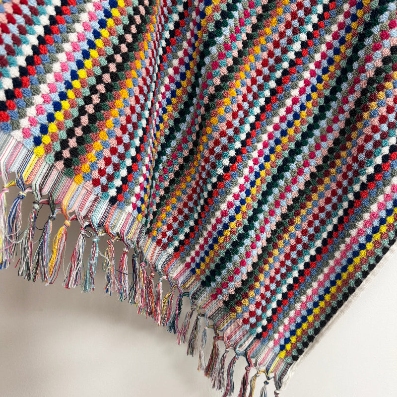 Sustainable recycled cotton towels with tasselled fringe, in multicolour stripe.