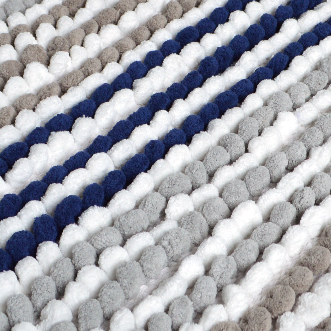 close up of a chunky bobble pedestal mat in navy blue