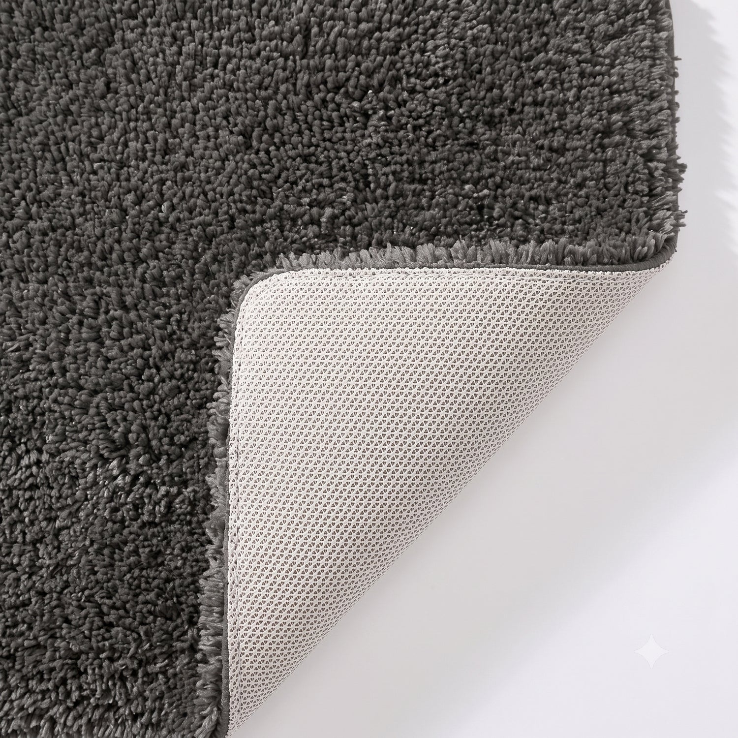 Grey non slip bath mat with rubber backing.