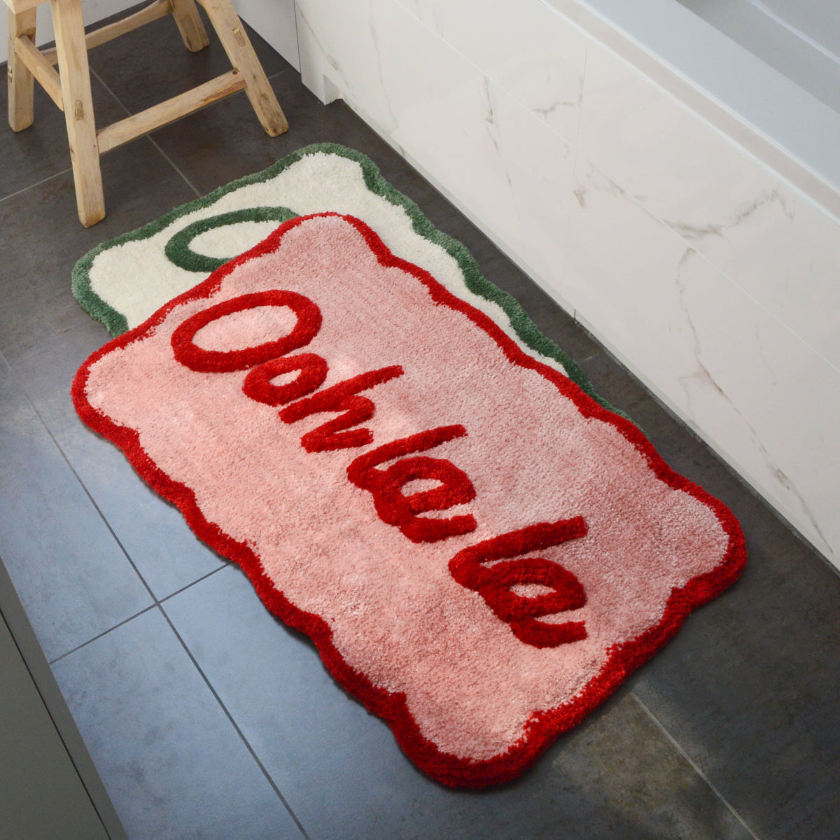 Fun and cute bath mats with shaped scalloped edges.
