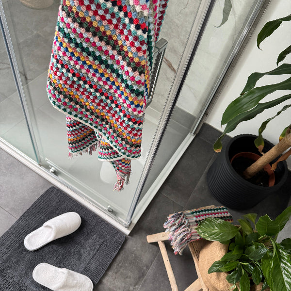 Colourful stripe towels for the bathroom in various sizes: hand towel, bath towel and bath sheet.