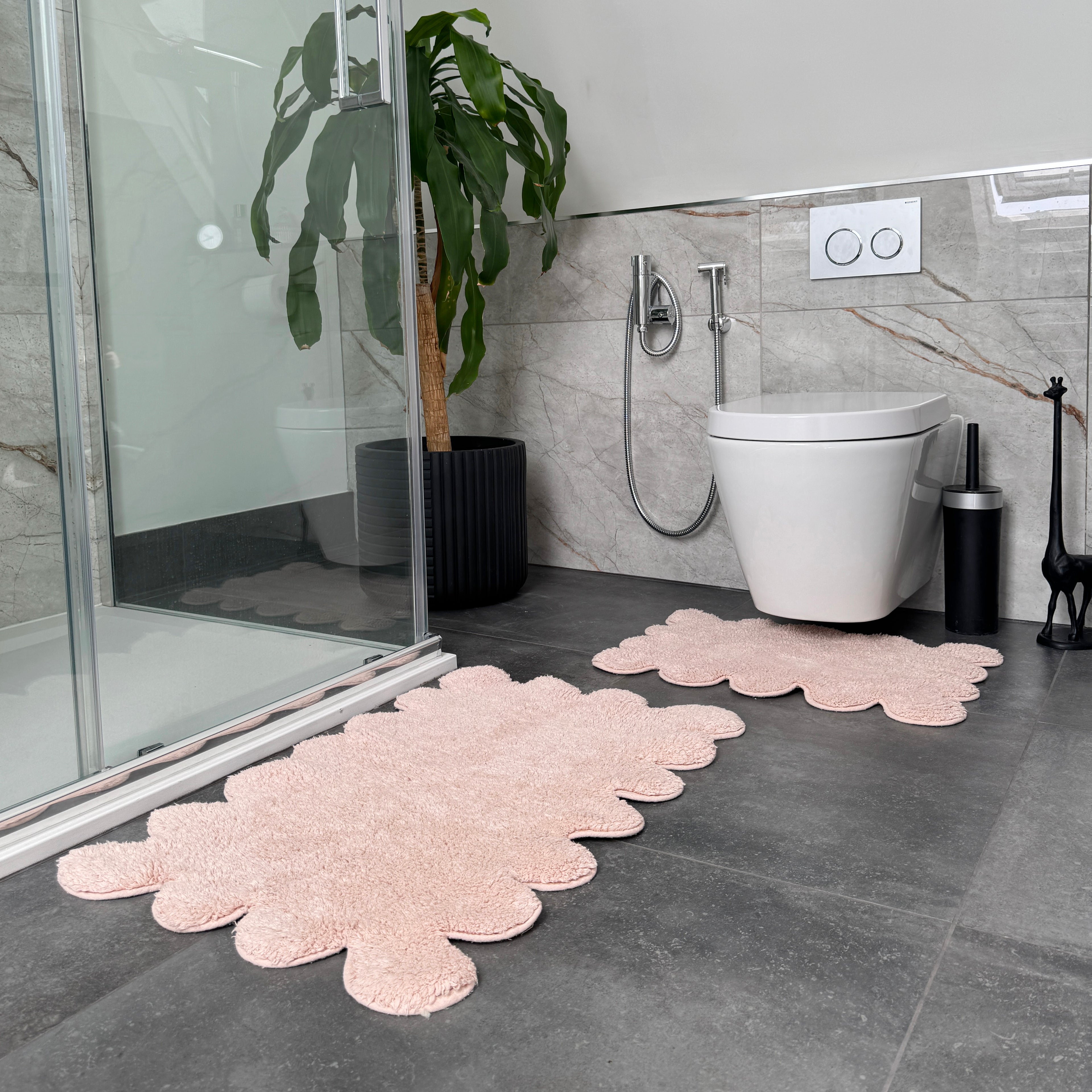 Pink 2pc bath mat and toilet mat set, scalloped cloud style.