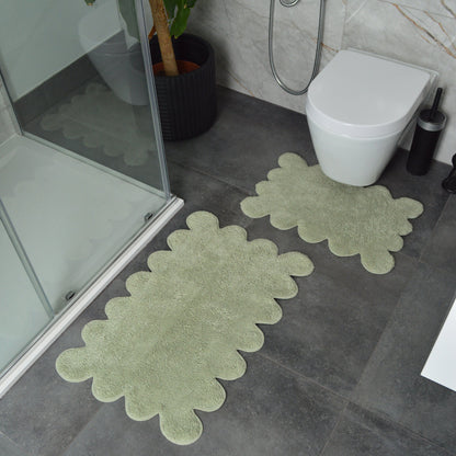 Sage green bath mat set, scalloped design.