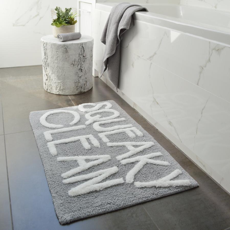 Grey and white slogan bath mat, squeaky clean