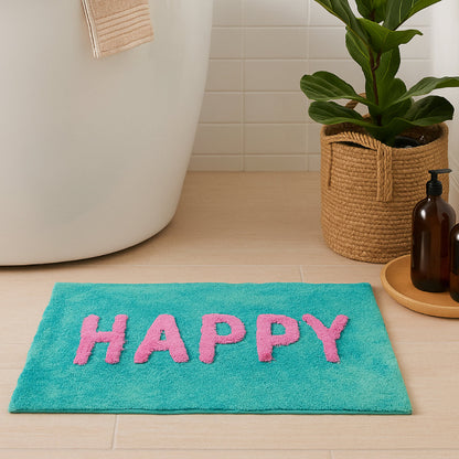 Turquoise bath mat with pink letters spelling &