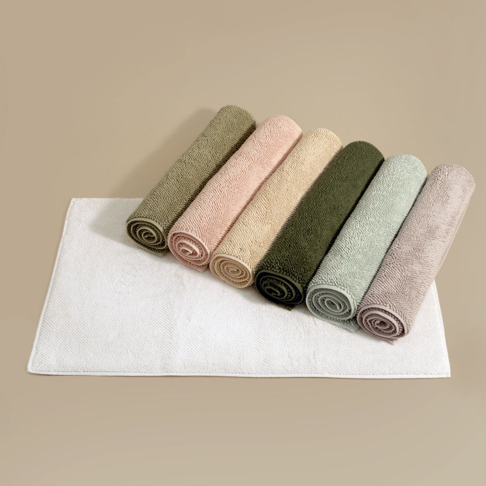 Organic cotton bath mats in various trendy colours for a modern and contemporary bathroom.