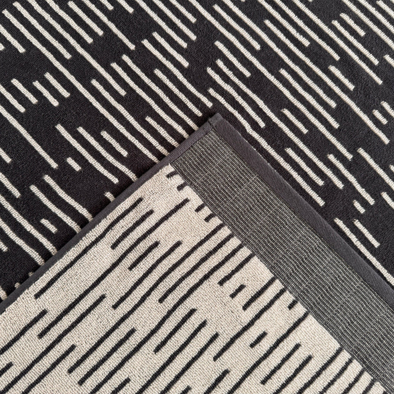 Stripe patterned bath towels, black and white.