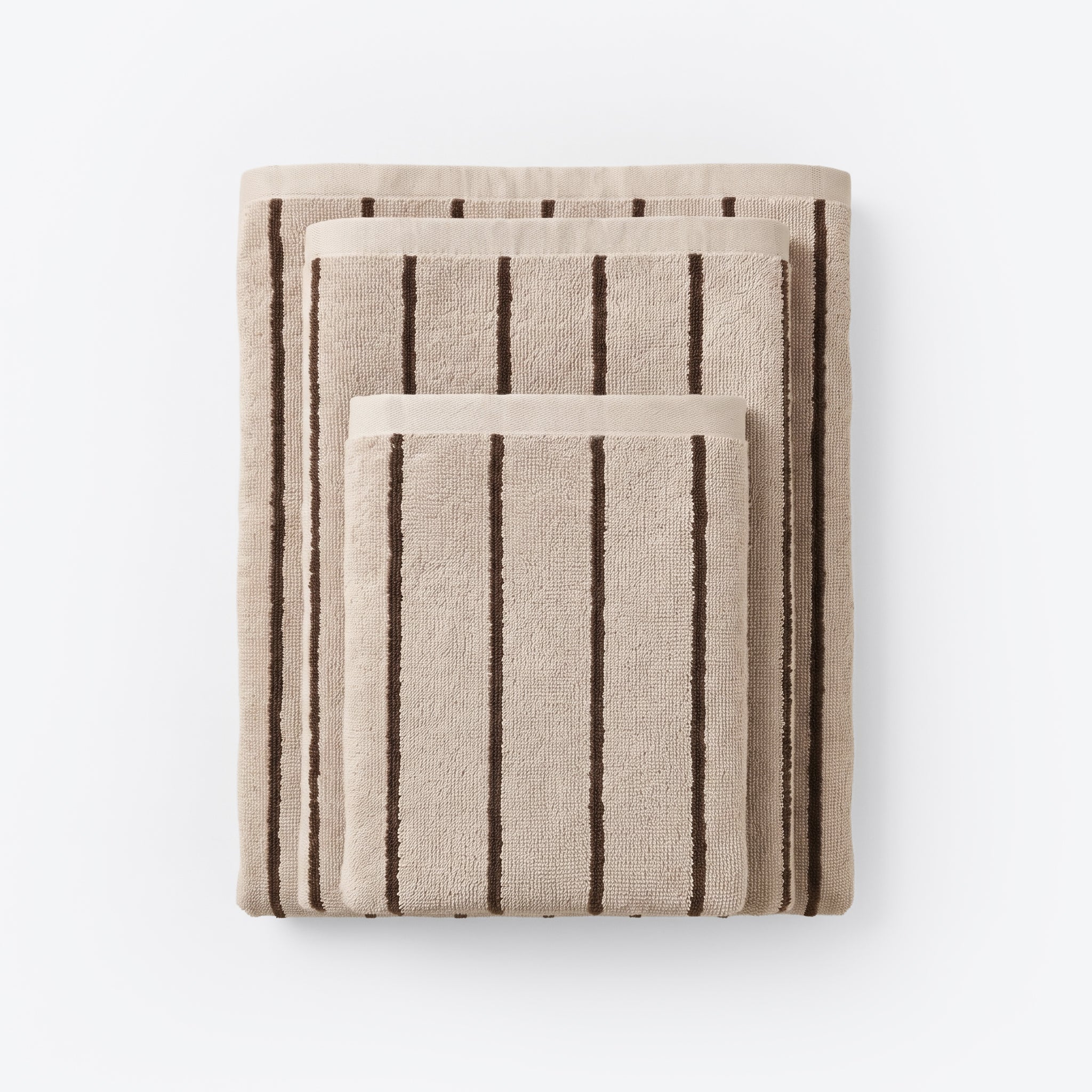 Striped bathroom towels in beige and brown colours - timeless pin stripe pattern.
