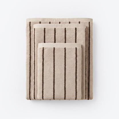 Striped bathroom towels in beige and brown colours - timeless pin stripe pattern.
