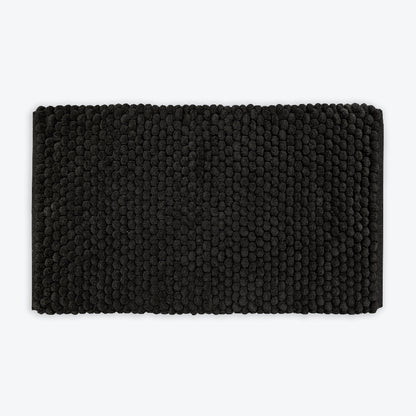 Black thick bath mat with luxury bobble texture. Super soft and absorbent washable rug.