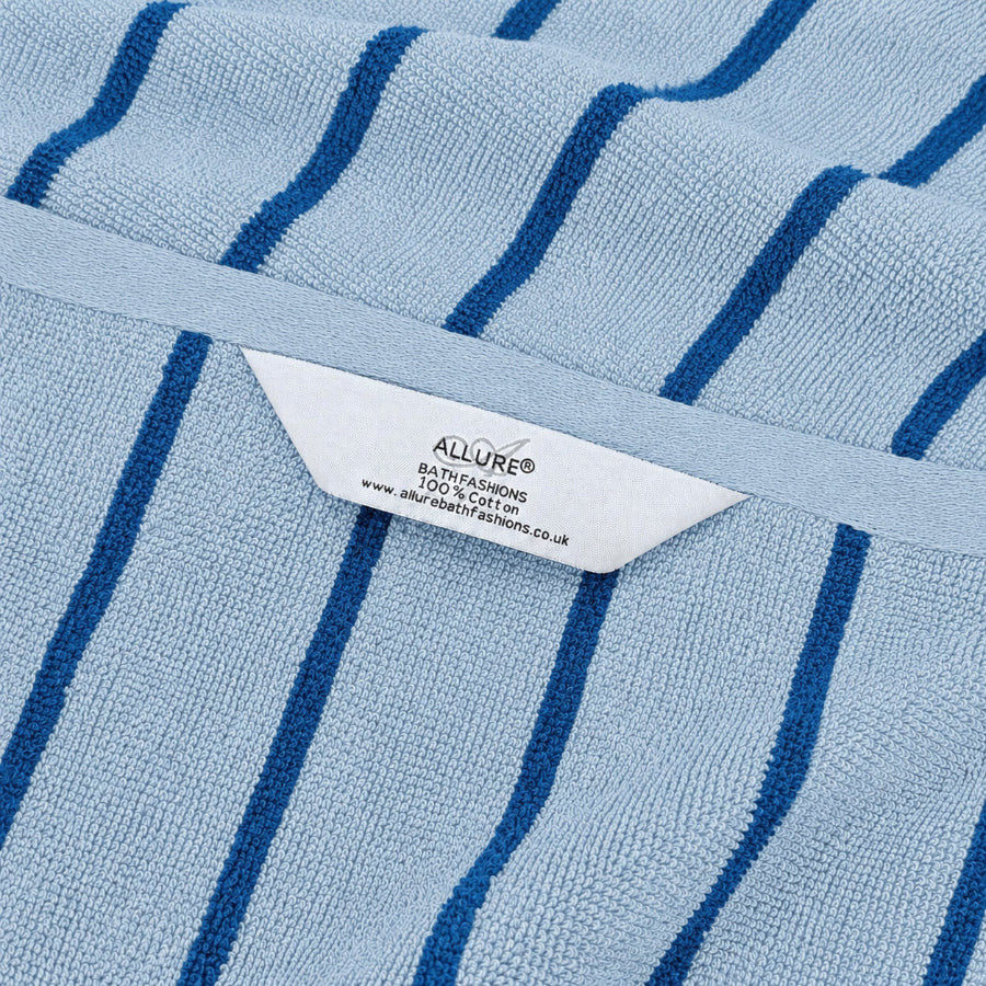 Blue striped towels with hanging hooks.
