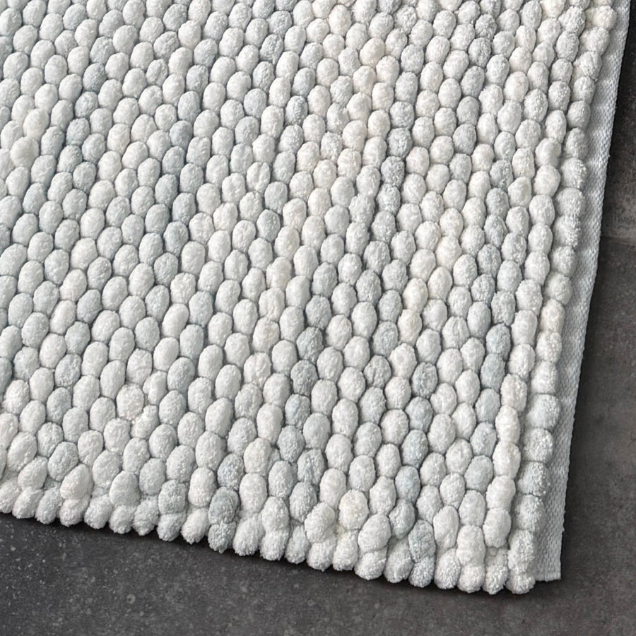 Luxury bath mats in marble pattern - grey and white chunky bobble design.