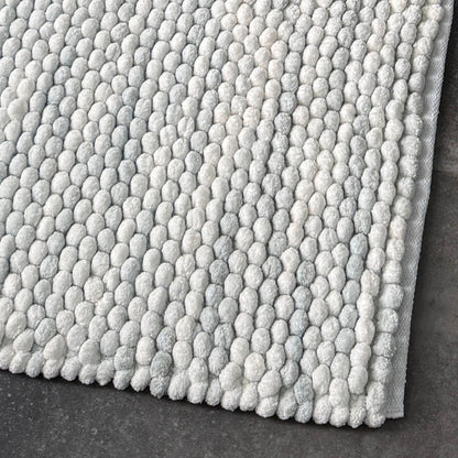Luxury bath mats in marble pattern - grey and white chunky bobble design.