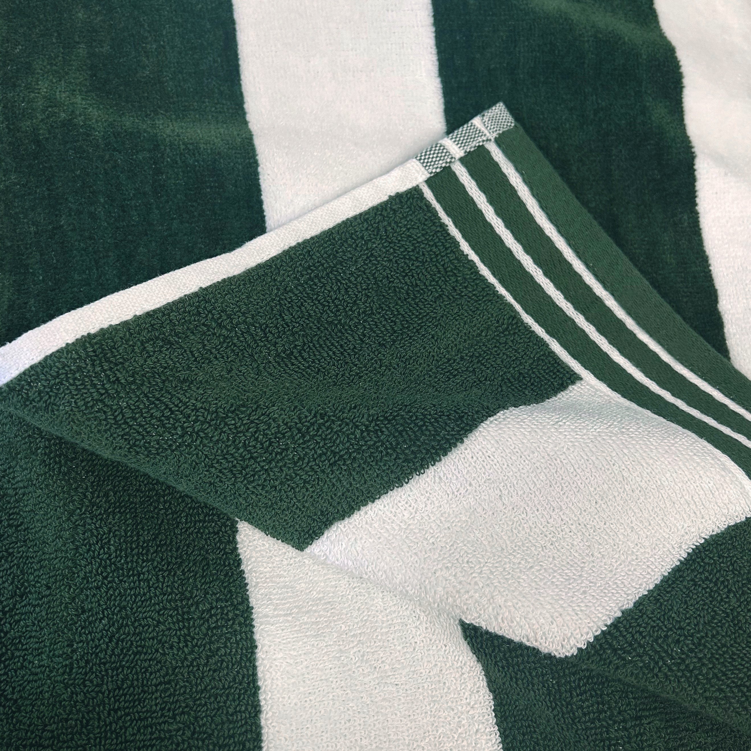 Extra large beach towel in green and white stripe.