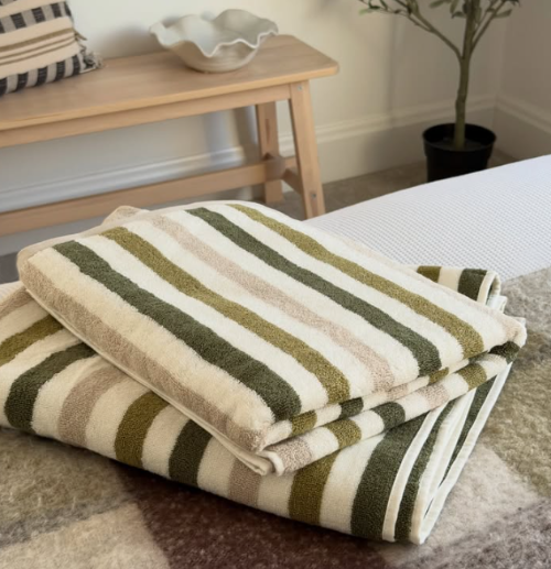 Set of stripe bath towels in green and neutral colours.
