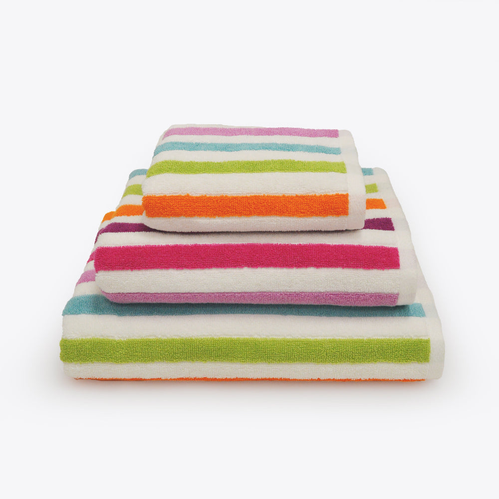 Set of colourful bathroom towels in 3 sizes - hand towel, bath towel and bath sheet. Rainbow towels in striped pattern.