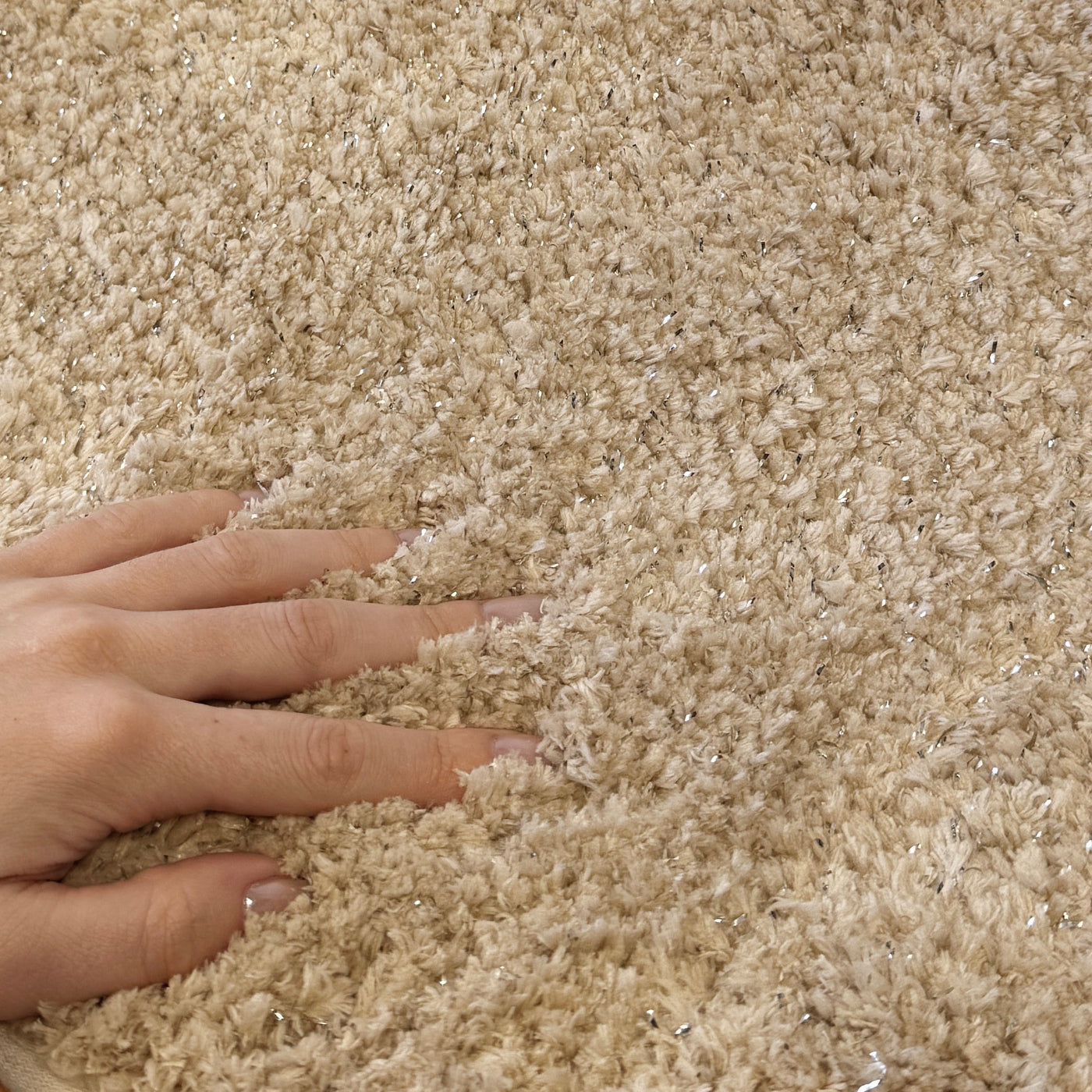 Small shower mat, deep pile shag in beige.