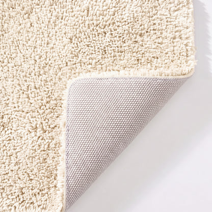 Cream non slip toilet pedestal mat with shaggy pile- 100% microfibre.