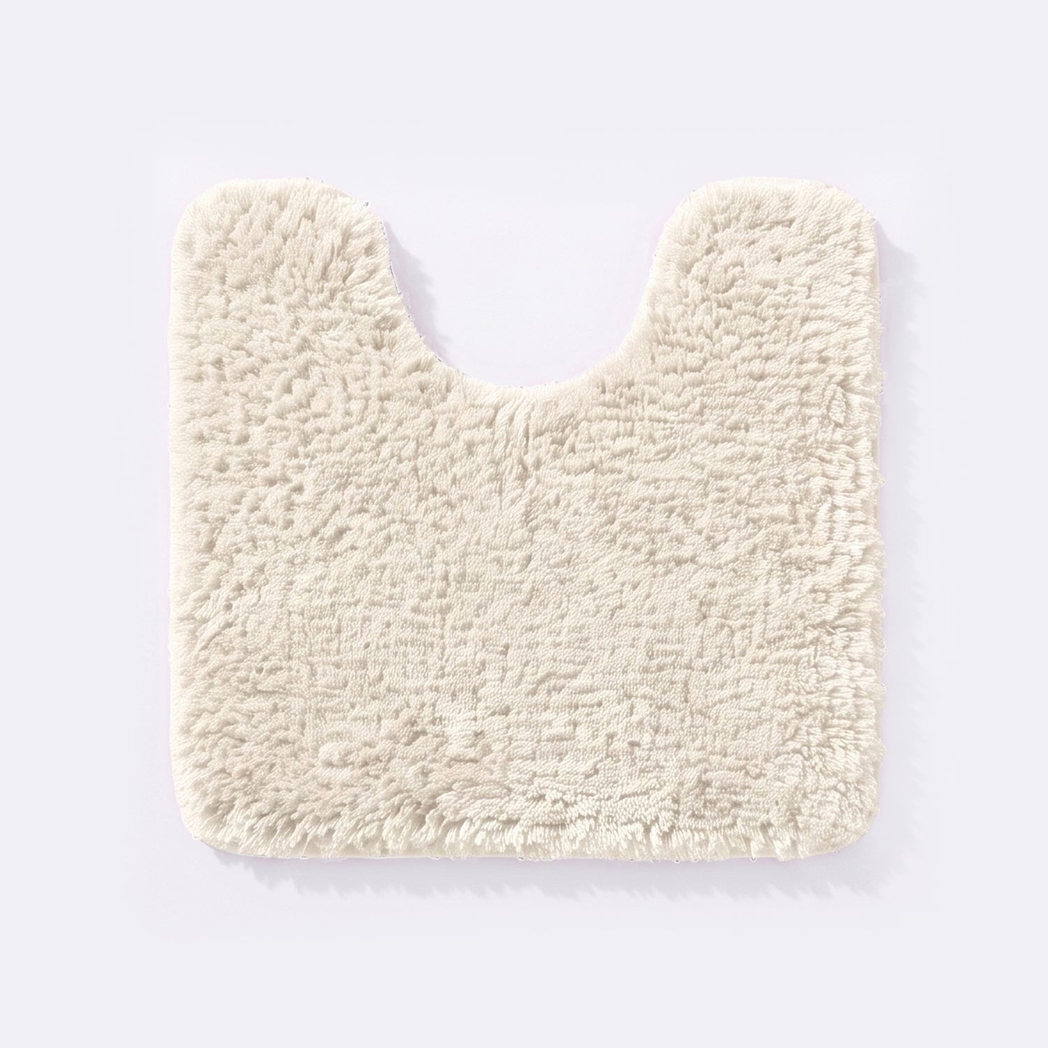 Cream non slip pedestal mat for the toilet or sink basin, plush shaggy microfibre pile.
