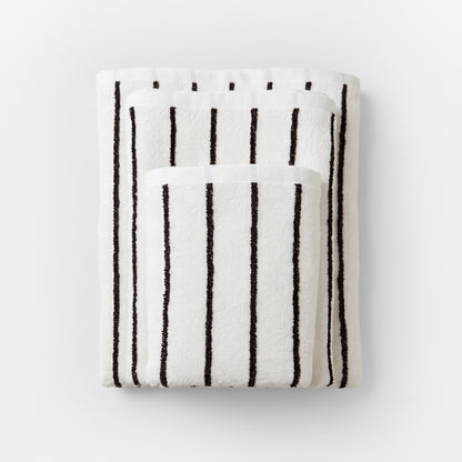 Striped bathroom towels in cream and black colours - timeless pin stripe pattern.