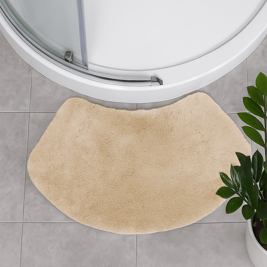 Beige bath mat for shower units in curved shape.