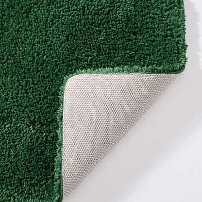Dark green bathroom mats with non slip rubber backing.