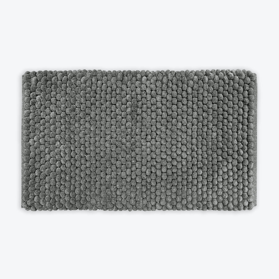 Dark grey thick bath mat with luxury bobble texture. Super soft and absorbent washable rug.