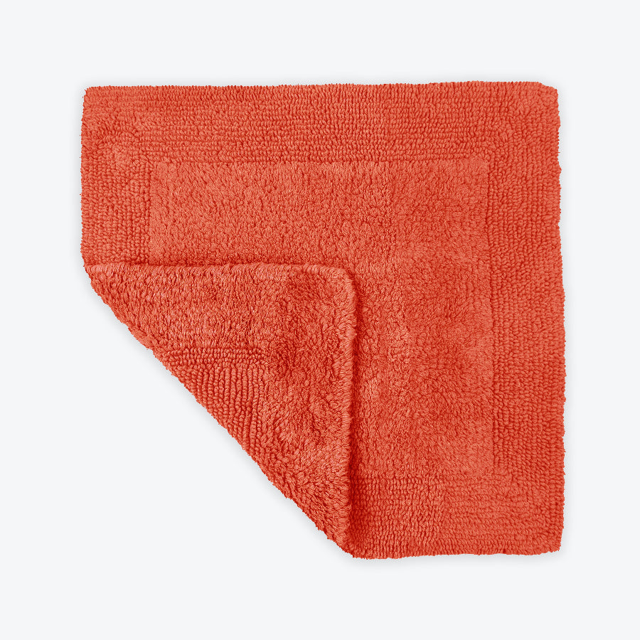 Terracotta square bath mat with reversible design. 100% cotton small bathroom rug. 