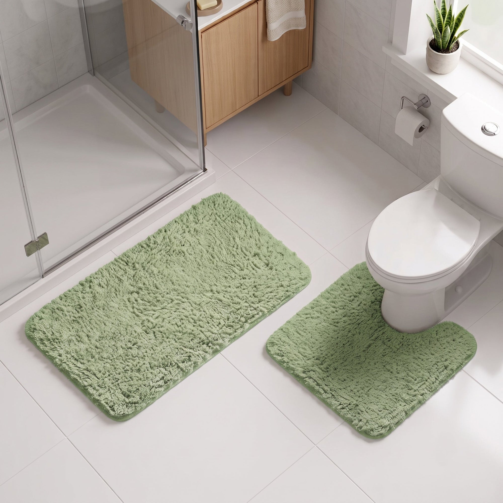 Set of sage green bathroom rugs made from buttery soft microfibre.
