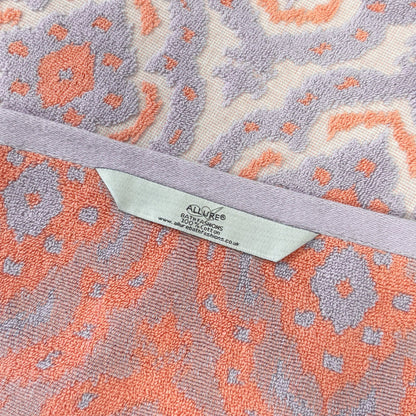 Patterned towels with hanging loops for quick drying and easy storage.