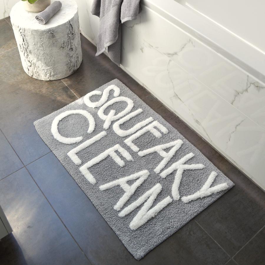 Squeaky clean slogan bath mat