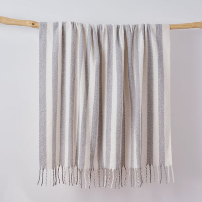 Grey and white striped throw blanket with tassels. Super soft faux mohair material.