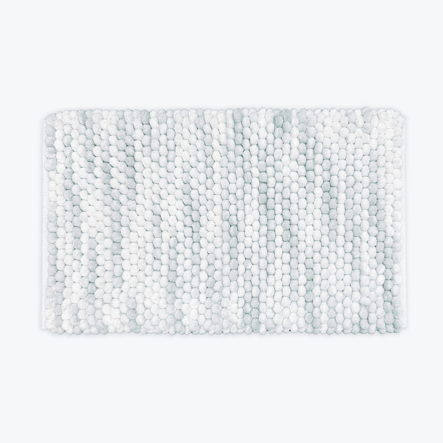 Grey and white marble bath mat in chunky bobble design.
