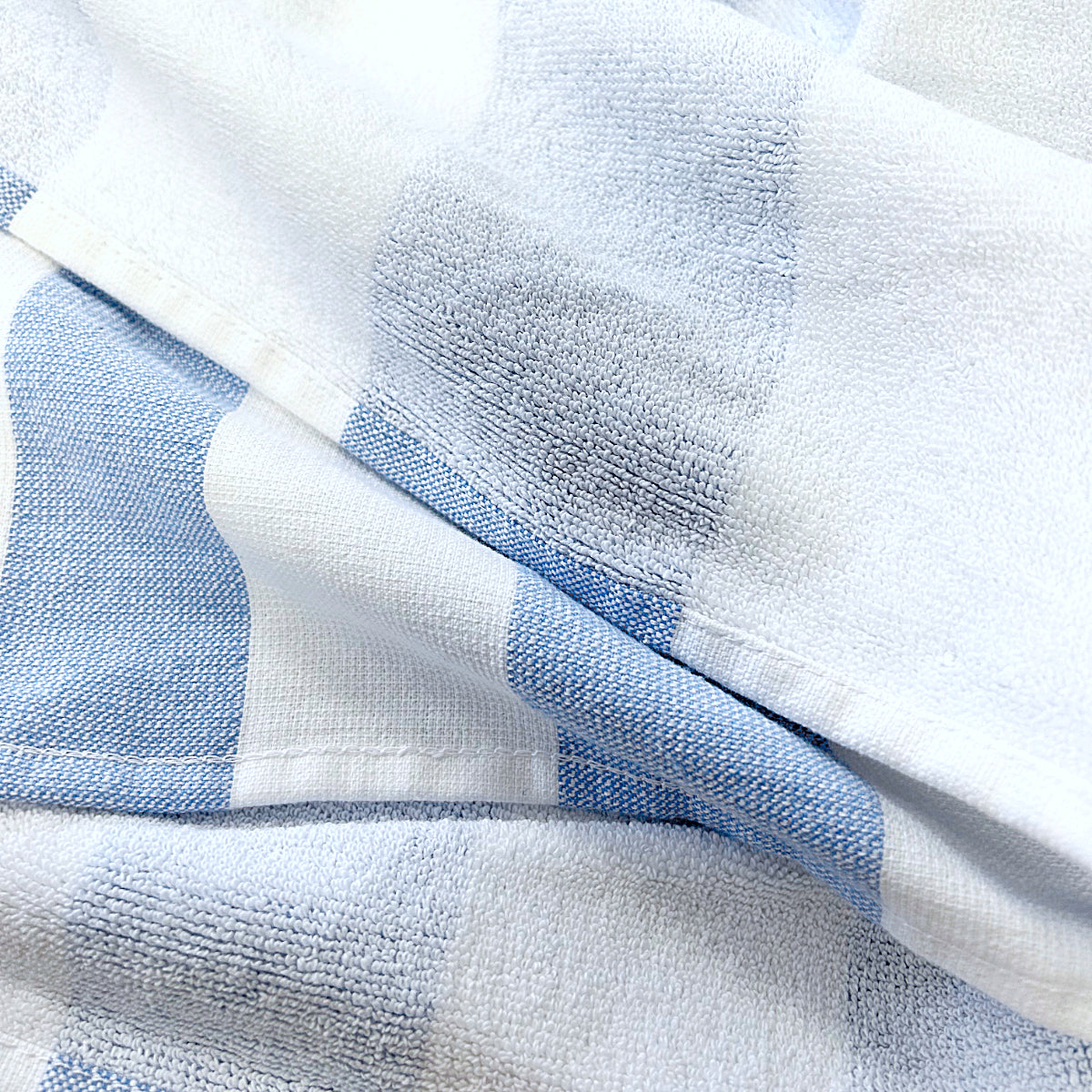 Soft and lightweight beach towel. Blue striped hammam towels.