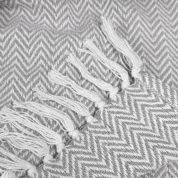 Grey and white herringbone throw with tasselled fringe - 100% cotton. 