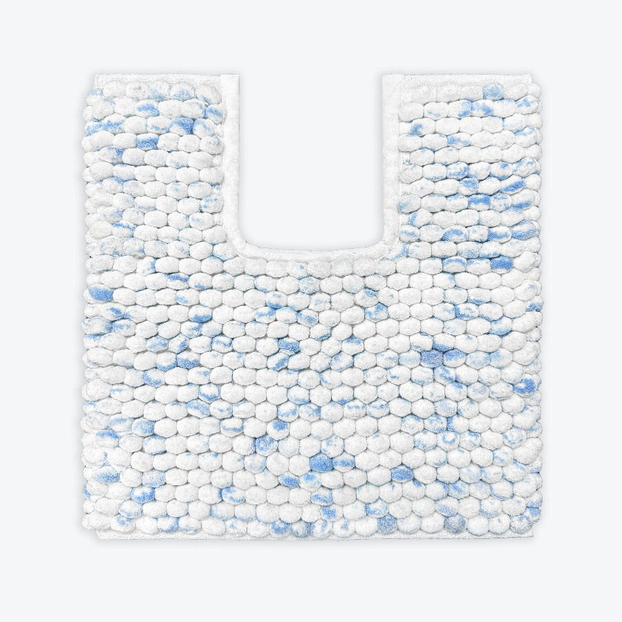 Blue and white pedestal mat in a modern marble deign - deep pile chunky bobble rugs.