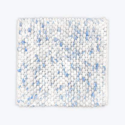 Blue and white small square bath mat in chunky bobble textured design.