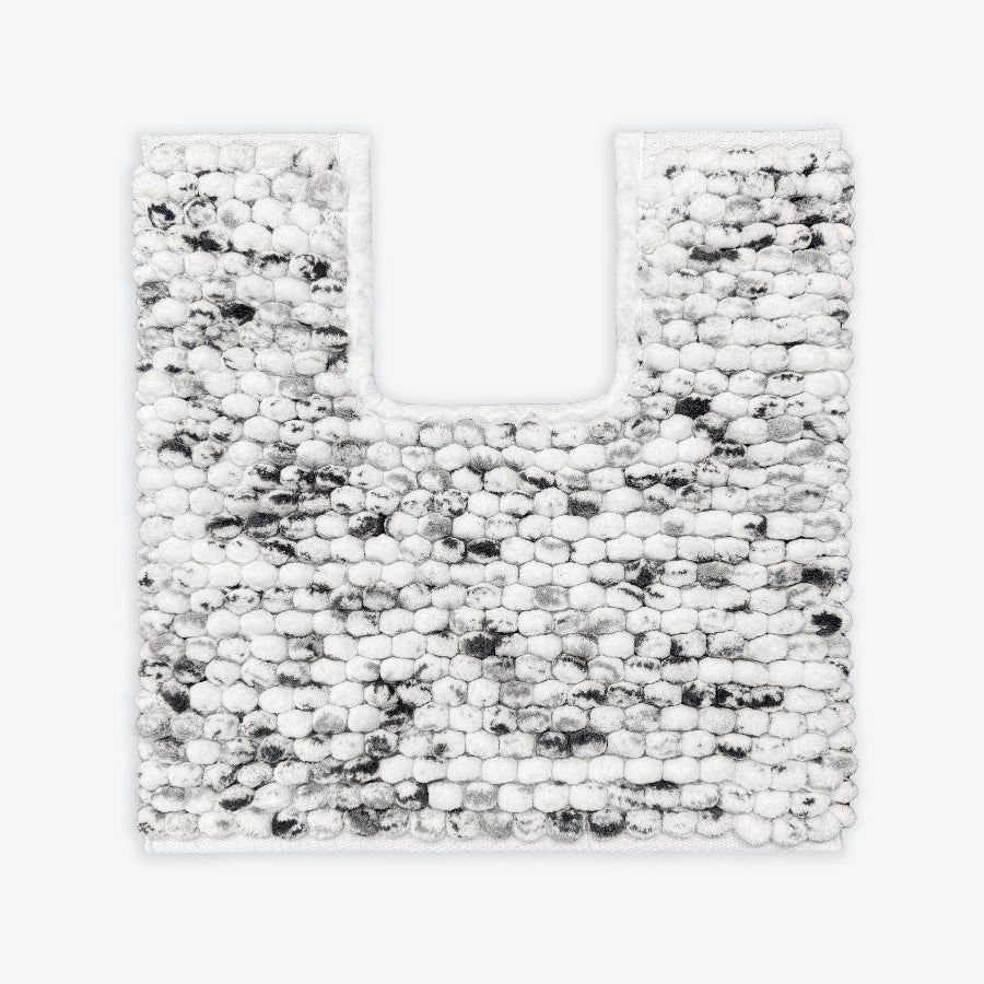 Black and white pedestal mat in a marl marble pattern. Chunky bobble textured bathroom mats.