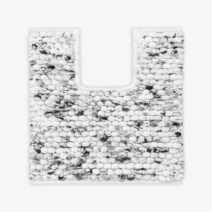 Black and white pedestal mat in a marl marble pattern. Chunky bobble textured bathroom mats.