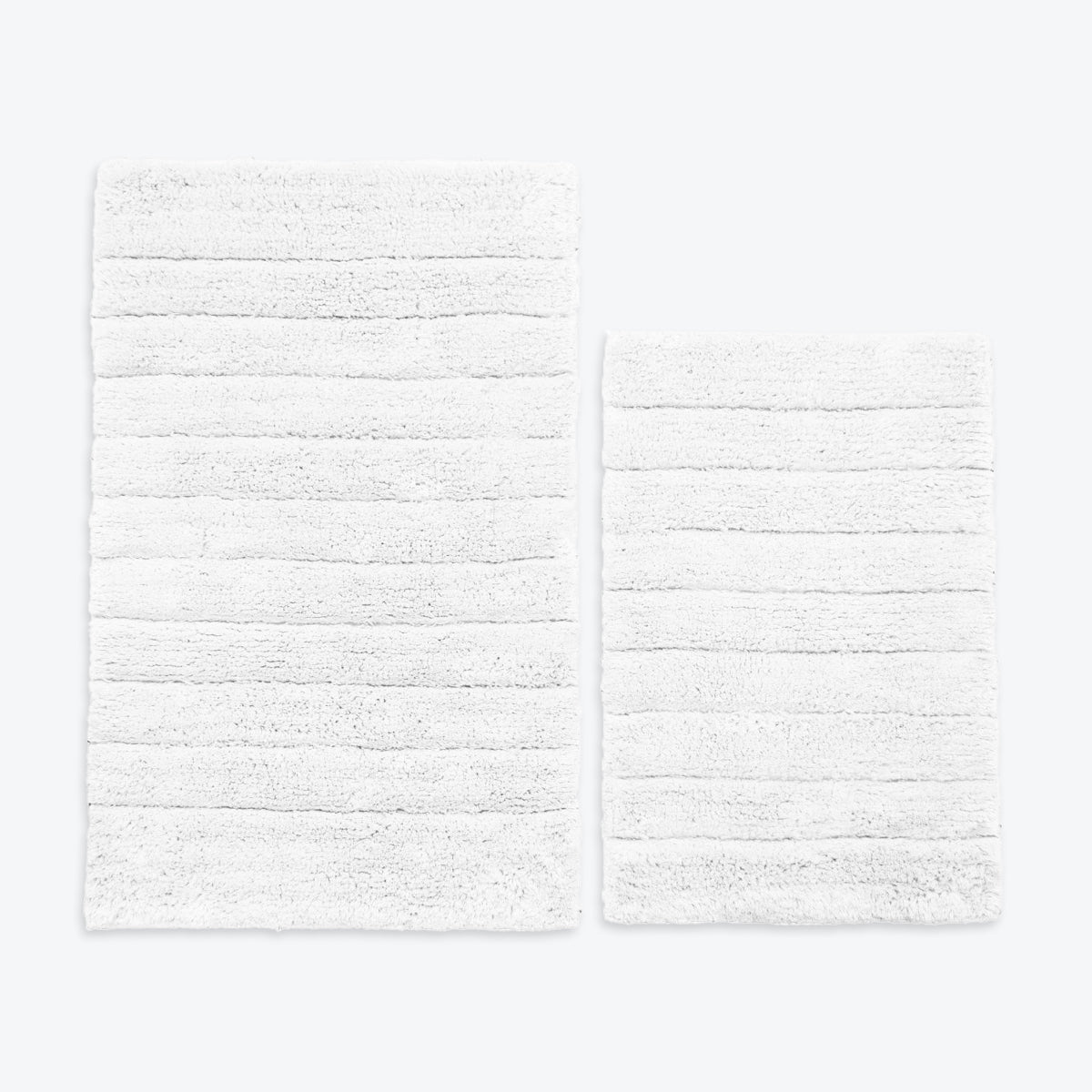 White 2pc bath mat set, 100% cotton.