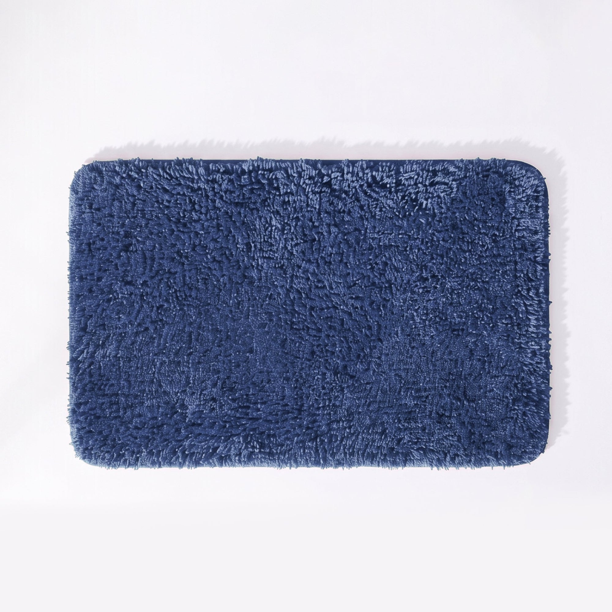 Mid blue non slip bath mat with soft deep pile.