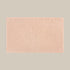 Blush pink bath mat made from organic cotton. Soft and sustainable bathroom accessories.