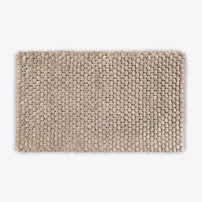 Neutral brown thick bath mat with luxury bobble texture. Super soft and absorbent washable rug.