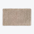 Neutral brown thick bath mat with luxury bobble texture. Super soft and absorbent washable rug.