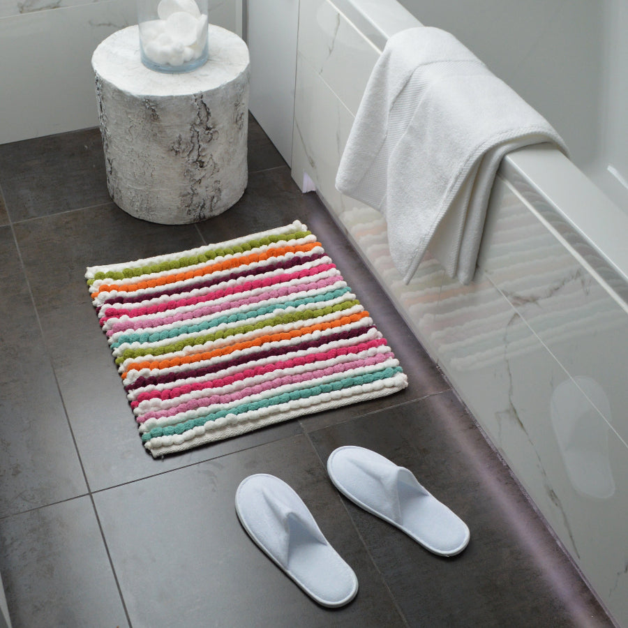 Chunky bobble square bath mat in multicolour stripe pattern.