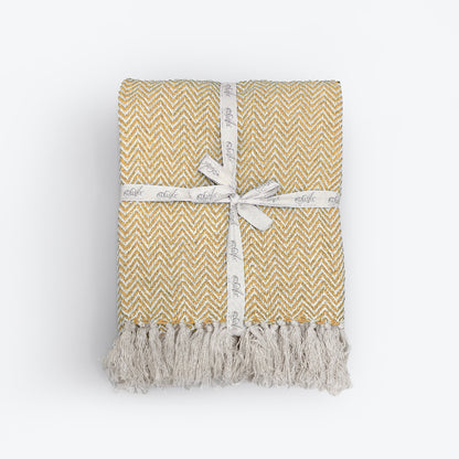 Mustard yellow throw blanket for the bedroom or sofa. 100% cotton throw in herringbone pattern.